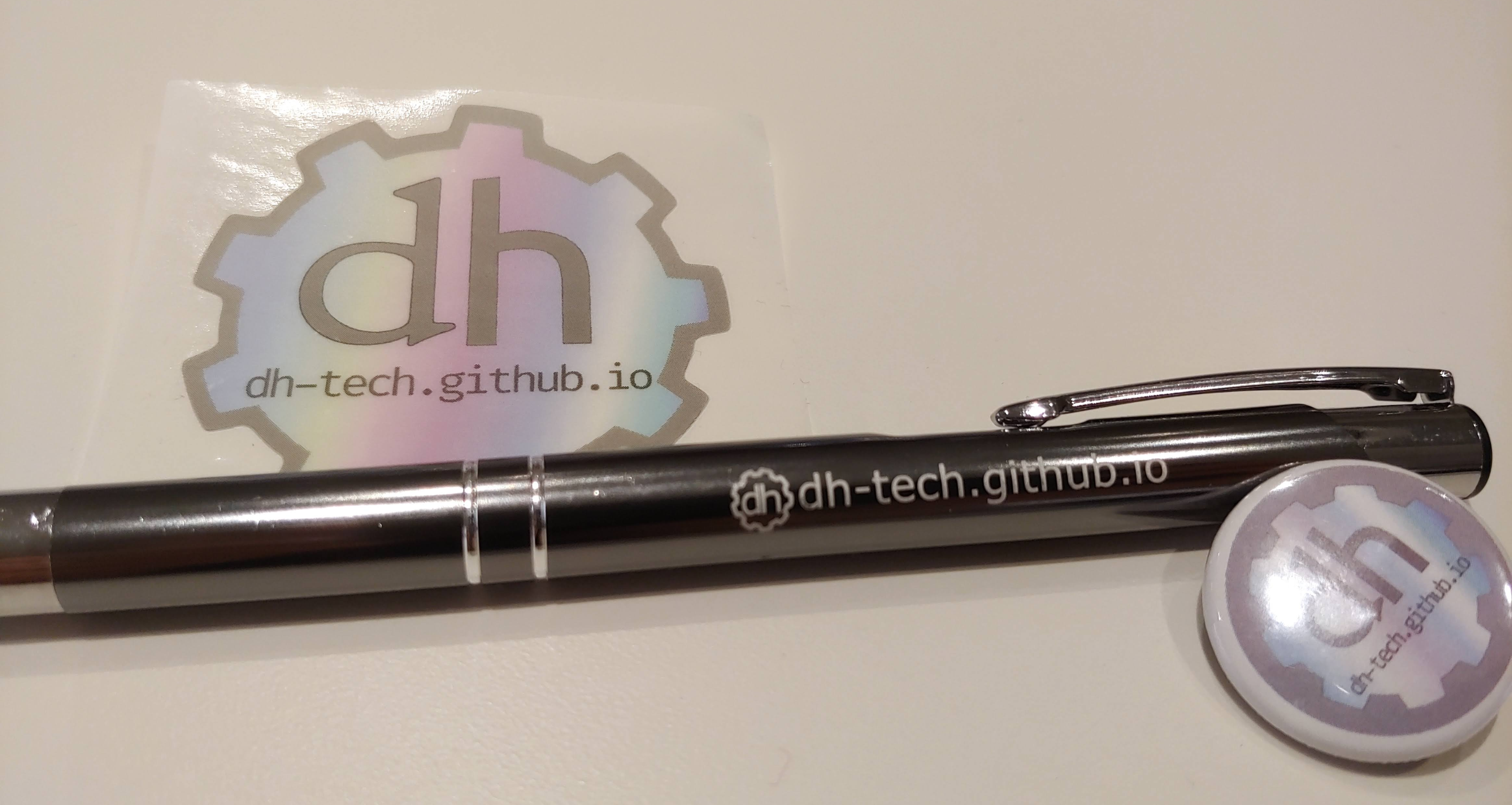 photo of a sticker, pen, and pin with variations of new DHtech logo